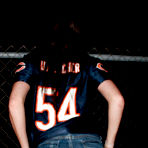 Second pic of Naughty brunette chick Freckles with perky tits makes a strip show outdoors