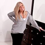 First pic of Blonde teaser Meet Madden smiling and slowly sliding the white top down