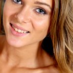 Third pic of Stunning tanned teen blonde Dana P poses for softcore pics with her shaved cooch on display