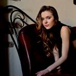 Third pic of Gorgeous teen Dana P is slowly releasing her body off dress and posing in black stockings