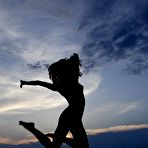 Third pic of The warm sun is petting the naked body of charming Divina A with the tender rays