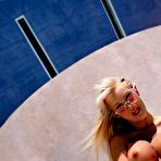 Third pic of Big titted pornstar Devon is posing her luxurious body against the luxurious car