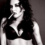 First pic of Smoking brunette Zoe Britton in high heels and black fishnet pantyhose fantastically teasing on camera.