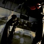 Fourth pic of Malou Rouge in stockings and high boots gives footjob to fucking machine