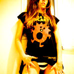 Third pic of Alternative girl Athena Hollow dressed in black shows off her nice ass and flashes her tiny tits