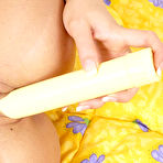 Fourth pic of Blonde babe on the bed Martina Fox wildly stretching hot bums when beading pussy on long dildo.