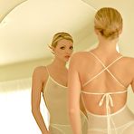 First pic of Glamorous leggy blonde Misty strips her sheer dress and thong then poses naked.