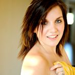 Third pic of Dark haired teen girl Myra FTV with playful smile shows her nipples at home