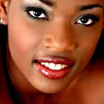 Fourth pic of Hot chocolate babe Brandi strips and shows her small tasty tits and hairy slit.