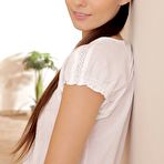 First pic of Ponytailed brunette dressed in all white shows her crotchless pantyhose - IamXXX.com