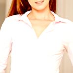 First pic of Redheaded teen in a tight skirt slowly undressing in an empty room - IamXXX.com