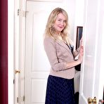 First pic of Blond-haired MILF in a dress showing off her beautiful body on the floor - IamXXX.com
