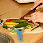 First pic of Dark-haired amateur with a ponytail bangs her pussy with a cucumber - IamXXX.com