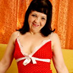 First pic of This horny housewife shows off on her couch
