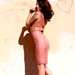 First pic of Kayla Jane with long legs and round ass poses in skin tight rubber dress