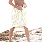 First pic of Caroline Lowe in blue bikini on a beach