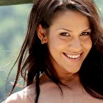 Fourth pic of Wavy-haired brunette teasing her tight little pussy next to a scenic view - IamXXX.com