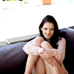 First pic of Dark-haired chick with perky tits spreading the cheeks to show her holes - aMetart.com