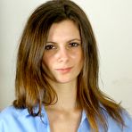 Second pic of College girl Martina in uniform and black panties unbuttons her blouse to show her perky tits