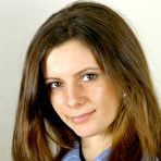 Third pic of College girl Martina in uniform and black panties unbuttons her blouse to show her perky tits