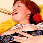 Second pic of Sexy cutie stroking her naked horny pussy and sticking a golden toy inside it (preview pictures)