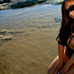 First pic of Samantha stripping fishnet on the beach
