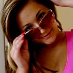 First pic of Colorfully dressed tanned young hottie slowly undressing on camera - IamXXX.com