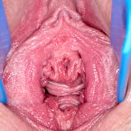 Fourth pic of Gorgeous Lovita Fate in a two-tone corset and shiny tan holdups uses a spreader