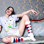 First pic of Pale-skinned brunette beauty spreading her pussy lips on a sofa - IamXXX.com