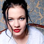 Second pic of Pale-skinned brunette beauty spreading her pussy lips on a sofa - IamXXX.com