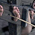 Second pic of SexPreviews - Lia Katt redhead is bound in different stocks for spanking and bdsm sex