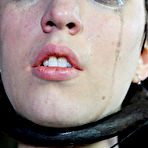 First pic of SexPreviews - Cherry Torn is bound in metal device for blindfolding and cock sucking in dungeon