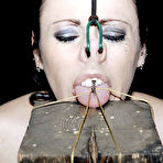 Third pic of SexPreviews - Moxxie Maddron bound upside down and nailed down by maledom in dungeon