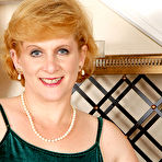 First pic of [All Over 30] Plump redhead granny modeling in dress before posing naked - IWantMature.com