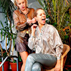 Fourth pic of Natalli Di Rossa swims in the pool clothed with another lady dressed in satin