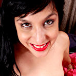 Third pic of [All Over 30] Black haired Betty Green toying her mature furry pussy in the bedroom - IWantMature.com