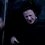 Third pic of SexPreviews - Moxxie Maddron bound in wooden stock for spanking and toying by maledom
