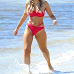 Fourth pic of Tallia Storm in red bikini on a beach