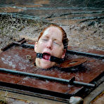 Second pic of SexPreviews - Calico Slave redhead is put in underground cellar and dominated with group spanking