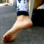 Second pic of Blonde Manchester shows off her tattooed feet and dirty soles in public place