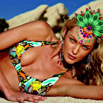 First pic of Candice Swanepoel posing in sexy bikinies for Catalogue