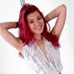 First pic of Redhead chick Sydney Mai is performing the Asian softcore nude dance at the pole