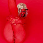 Second pic of Naked deviless Molly Winters with red skin and blonde hair demonstrates her snatch