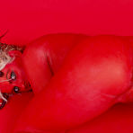 Third pic of Naked deviless Molly Winters with red skin and blonde hair demonstrates her snatch