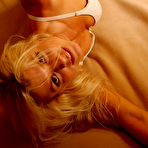 Second pic of Long haired muscle blonde Fawnia Mondey with sexy legs strips out of her tight panties