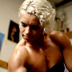 Second pic of Blonde Mihaela Radu in red panties and black top admires her muscles during workout