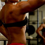 Fourth pic of Blonde Mihaela Radu in red panties and black top admires her muscles during workout