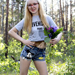 First pic of Stunning blonde babe wearing cute glasses strips naked in the woods and shows us her sweet natural tits. pics