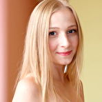 Third pic of Cute and horny blonde babe strips off her erotic red dress so she can reveal her perfect naked body. pics