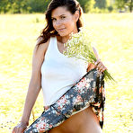 Third pic of Nude Suzanna A poses in the meadow baring her luscious body.